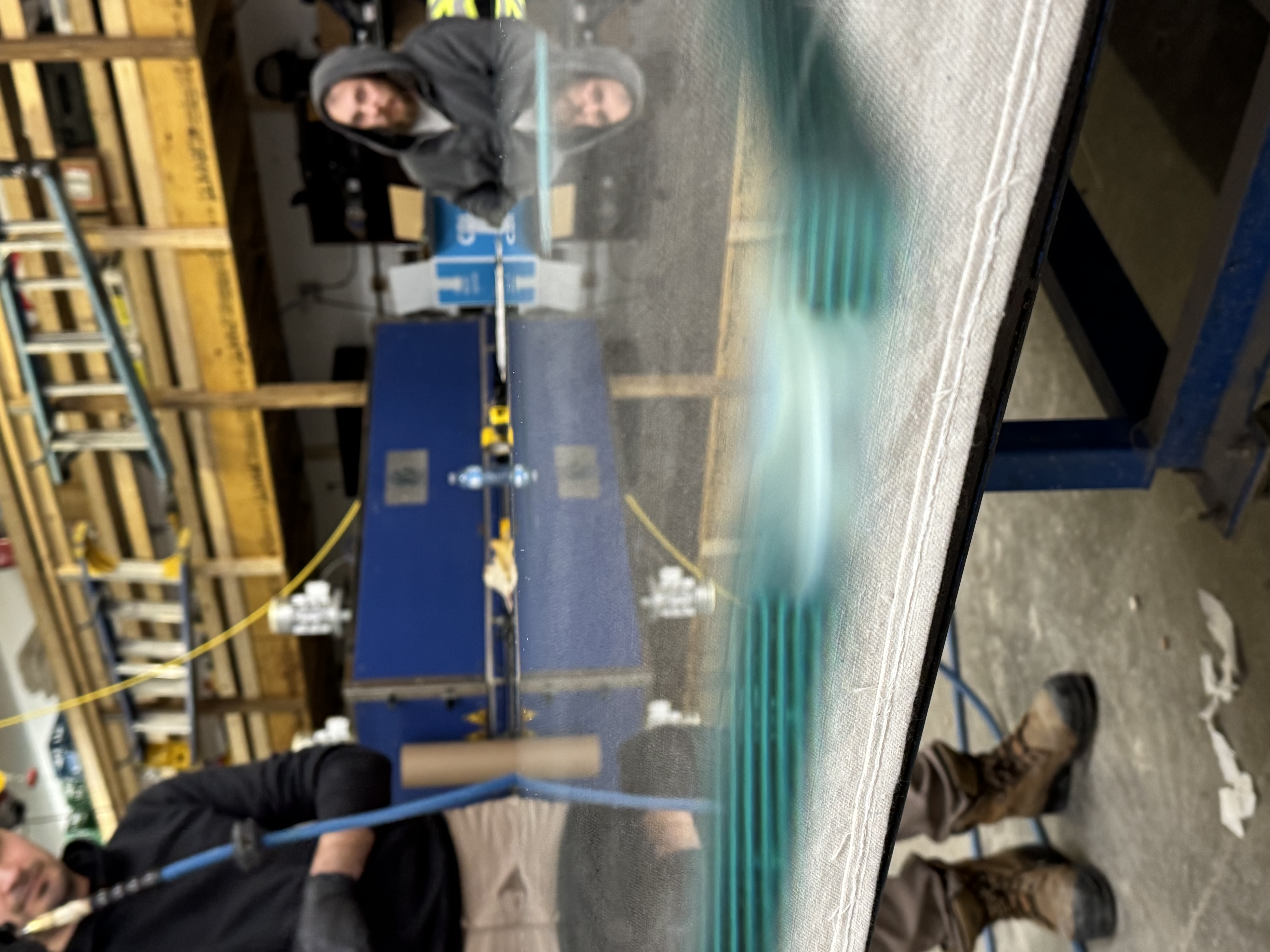 Thick stacked glass panels being prepared in a workshop