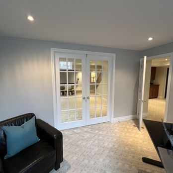 Finished room with installed French doors
